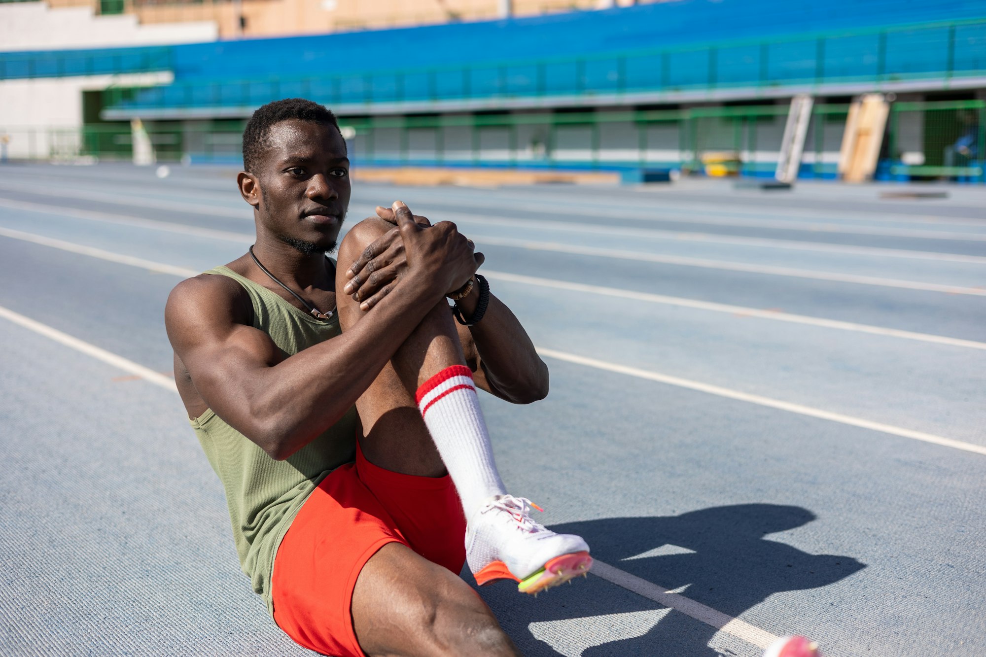 african athlete warming up on the athletics track