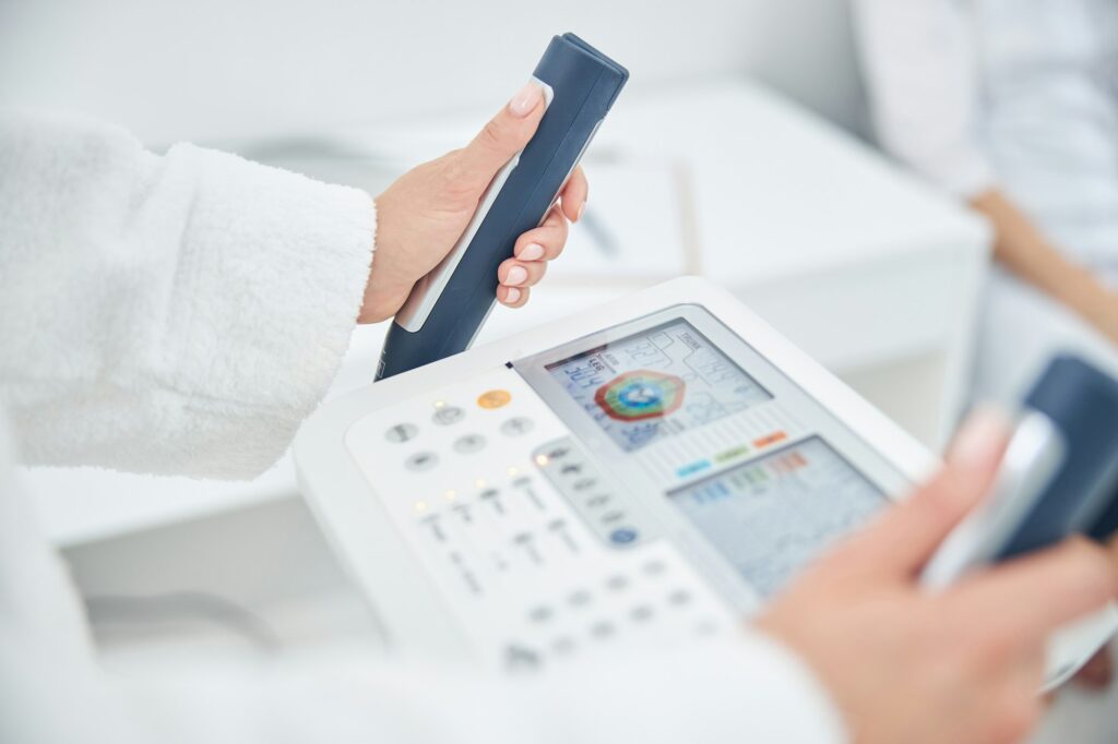 Portrait of woman hands on the modern technology device that showing indicators of the health