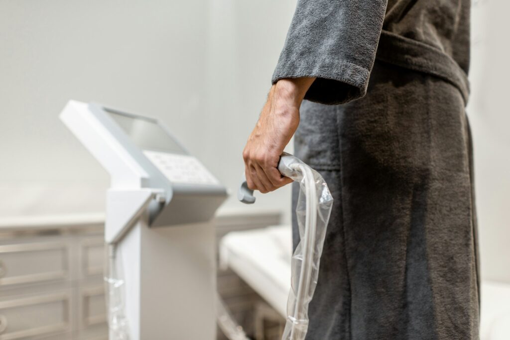 Man measuring body composition balance, close-up