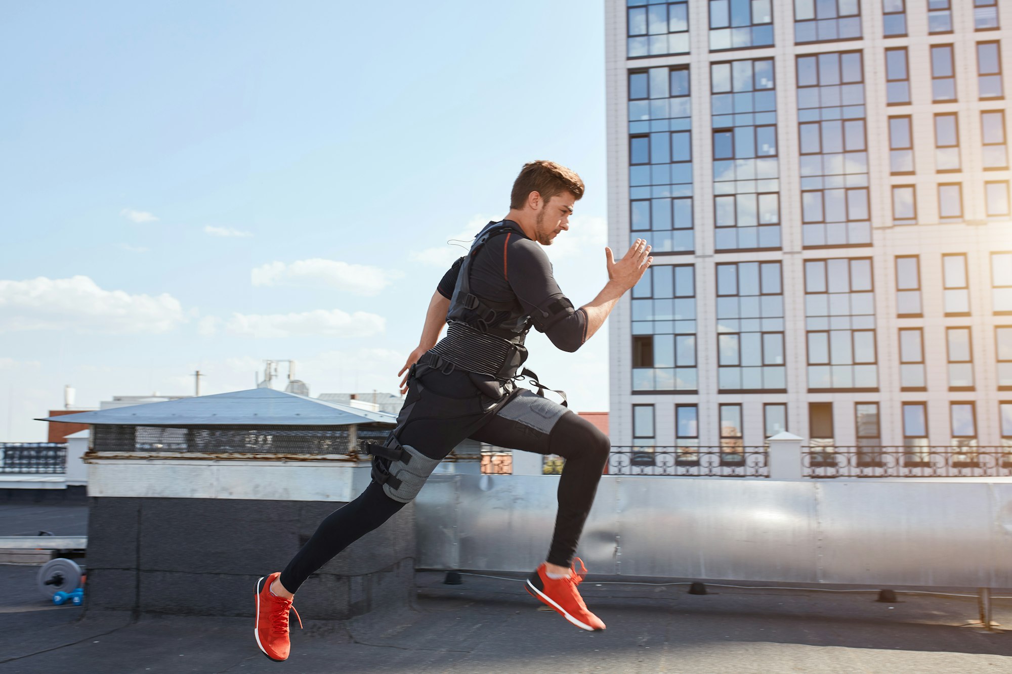 young man in a suit for EMS of a training is jumping